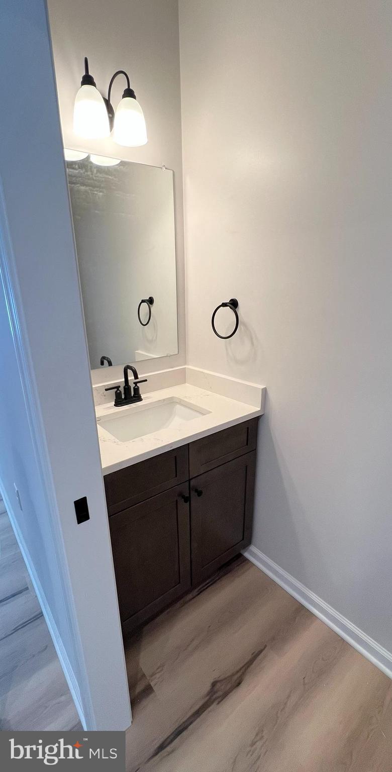 515 South Spring Street Martinsburg, WV 25401 - Photo 7 of 20 a bathroom with a sink and a mirror