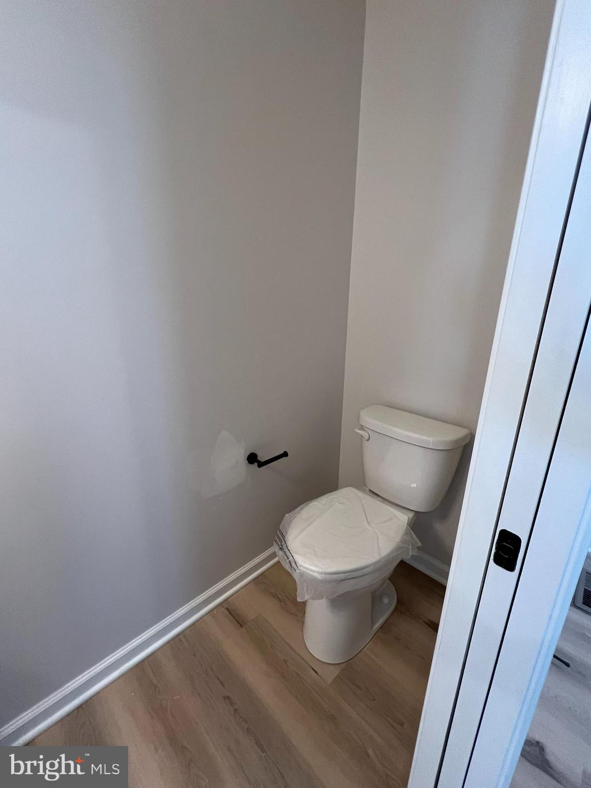 515 South Spring Street Martinsburg, WV 25401 - Photo 8 of 20 a white toilet sitting next to a small sink