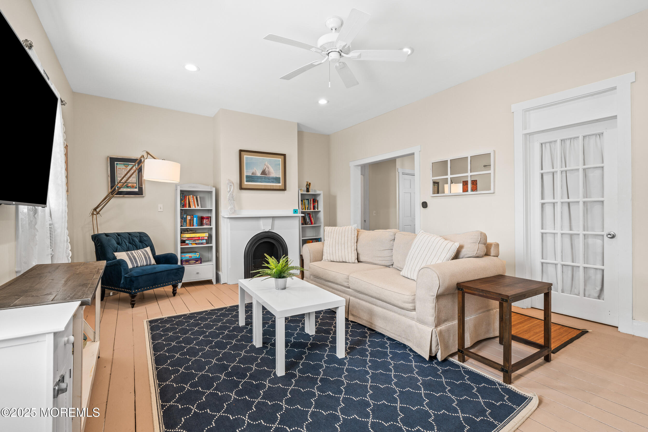18 Abbott Avenue Ocean Grove, NJ 07756 - Photo 16 of 84 a living room with furniture a flat screen tv and a fireplace