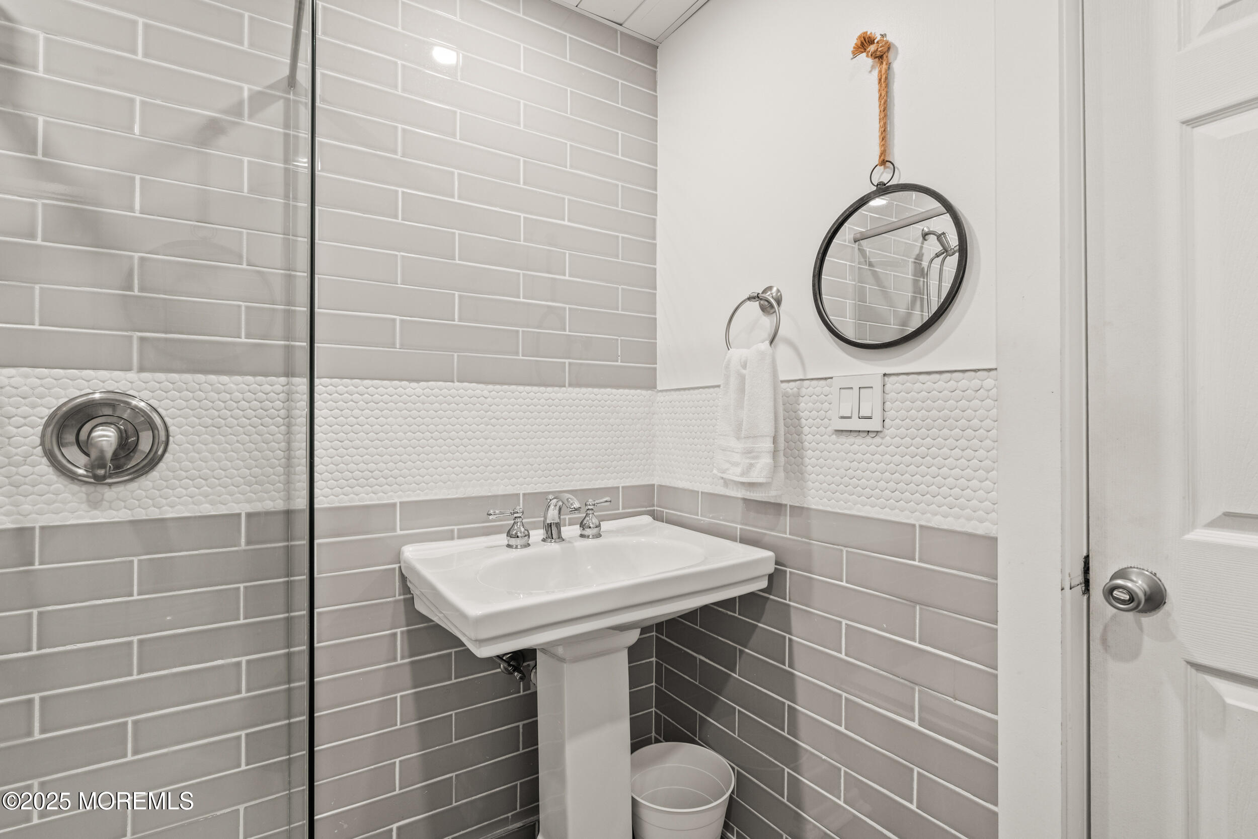 18 Abbott Avenue Ocean Grove, NJ 07756 - Photo 24 of 84 a bathroom with a sink and a mirror