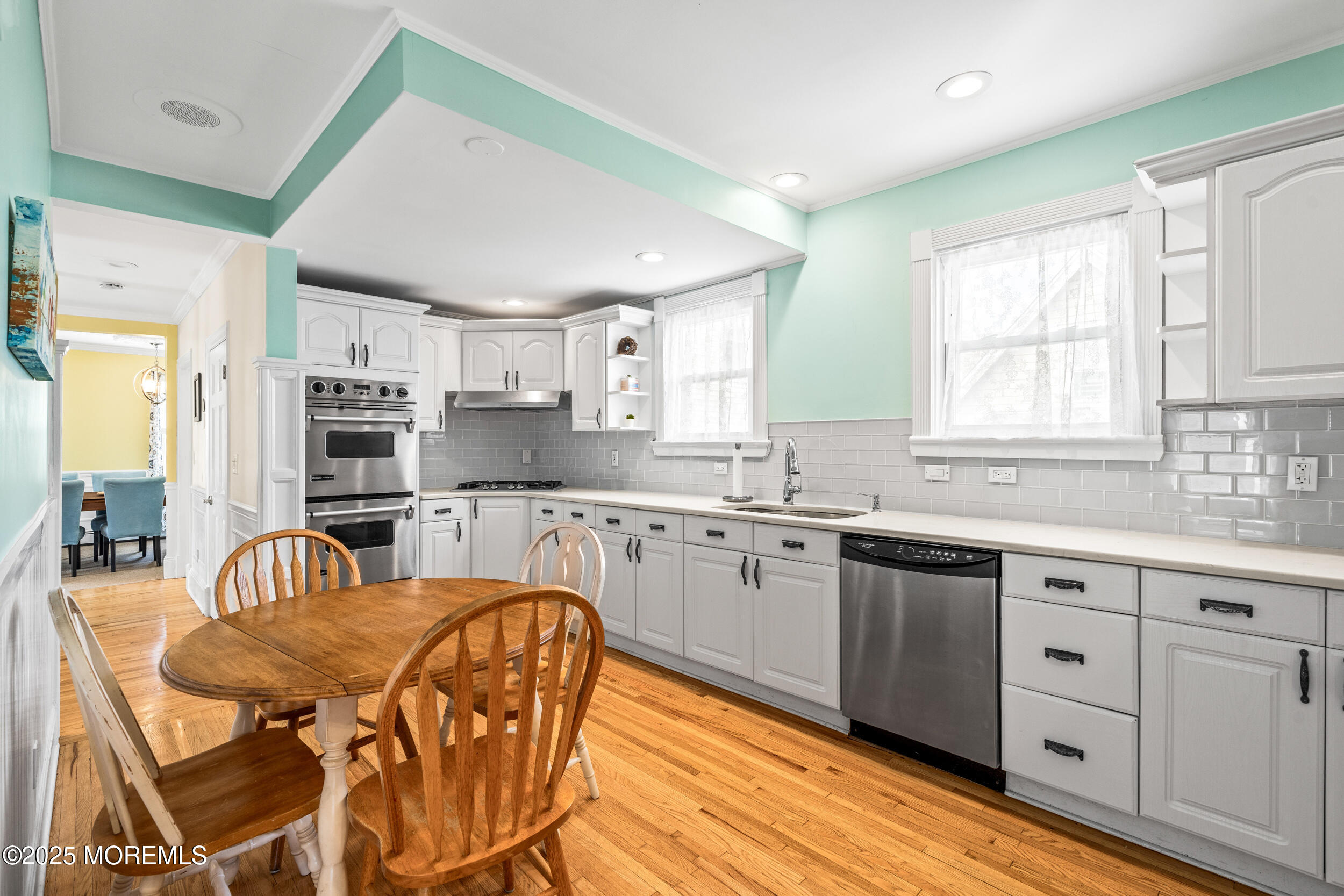 18 Abbott Avenue Ocean Grove, NJ 07756 - Photo 40 of 84 a kitchen with stainless steel appliances granite countertop a sink a stove a dining table and chairs