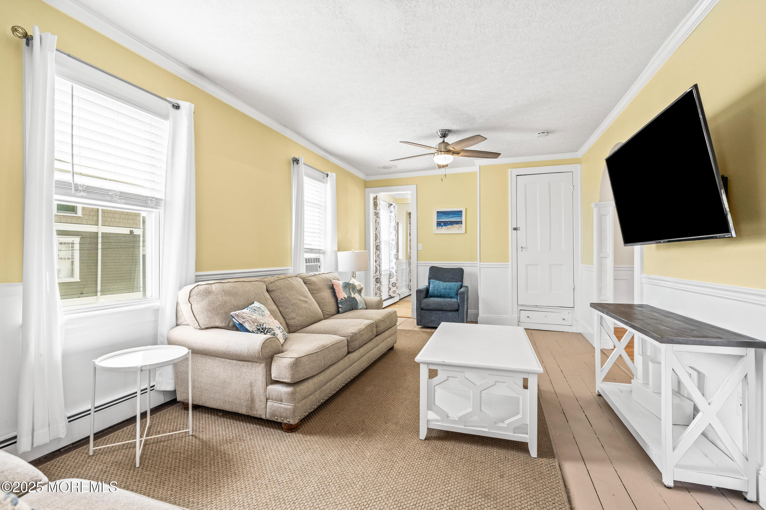 18 Abbott Avenue Ocean Grove, NJ 07756 - Photo 42 of 84 a living room with furniture and a flat screen tv