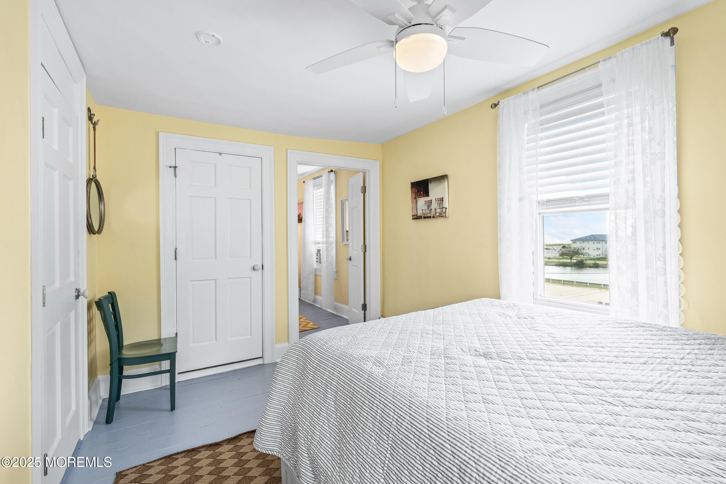 18 Abbott Avenue Ocean Grove, NJ 07756 - Photo 49 of 84 a bedroom with a bed and a chandelier