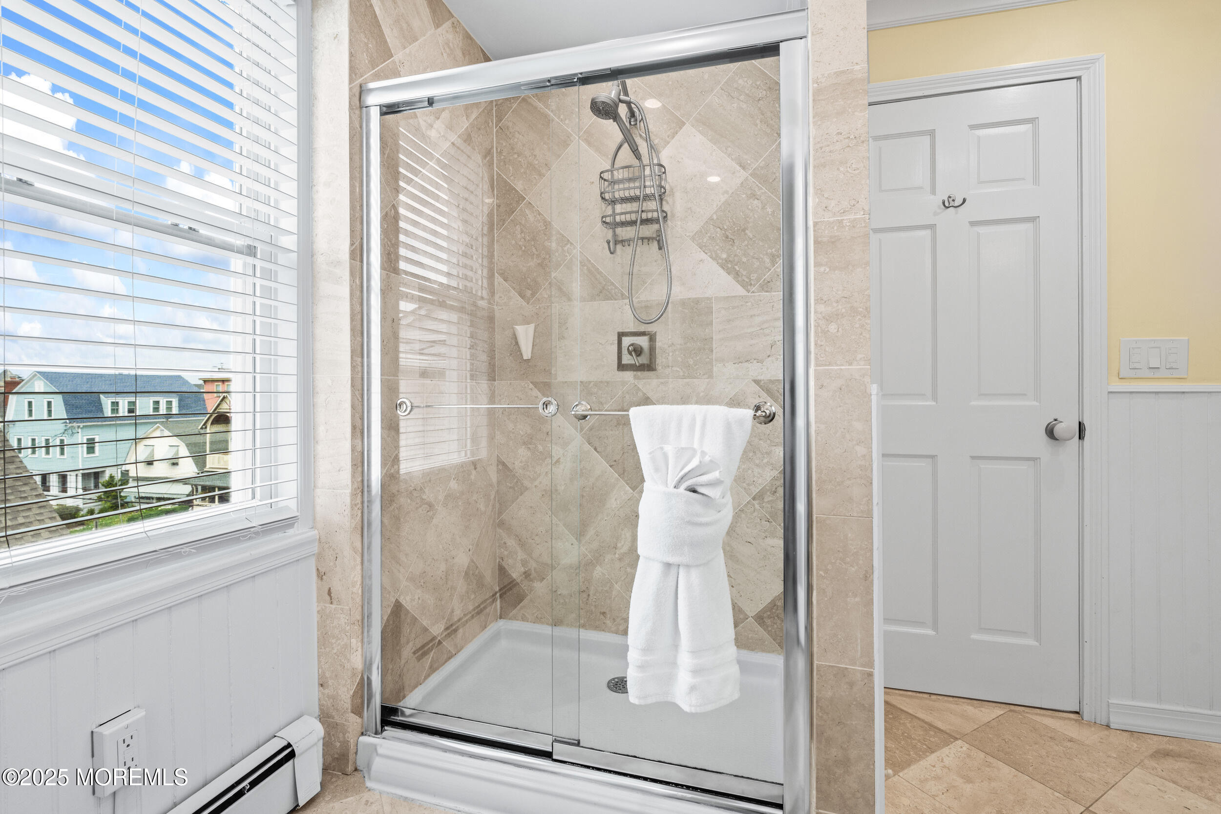 18 Abbott Avenue Ocean Grove, NJ 07756 - Photo 60 of 84 a bathroom with a glass shower door and a glass door