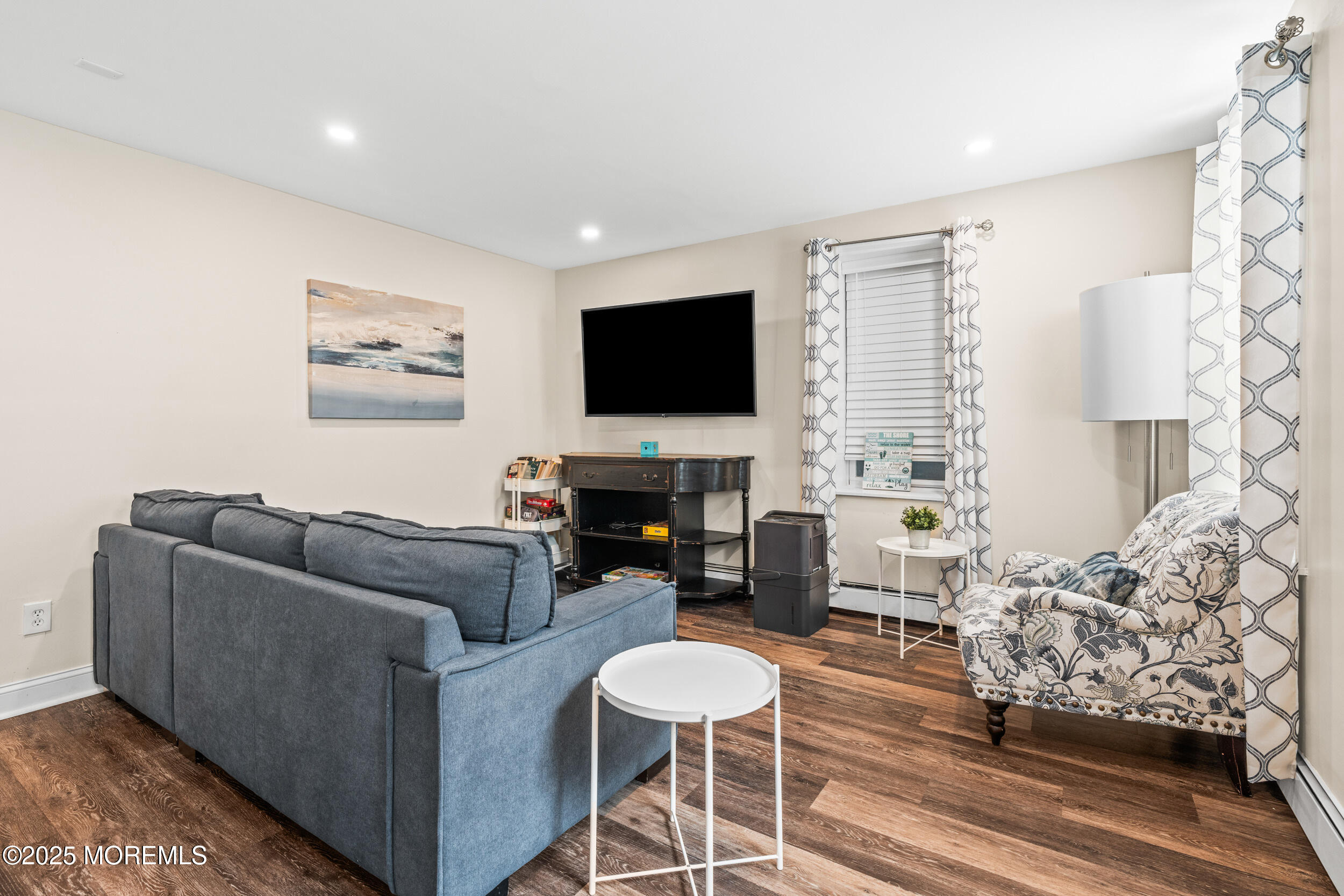 18 Abbott Avenue Ocean Grove, NJ 07756 - Photo 64 of 84 a living room with furniture and a flat screen tv