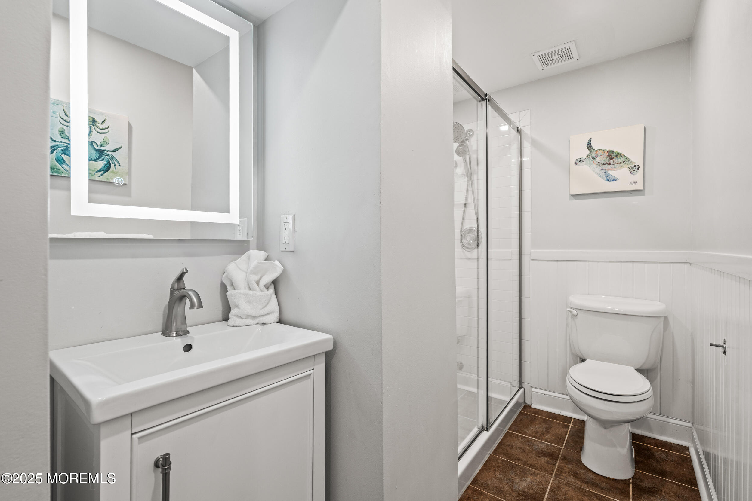 18 Abbott Avenue Ocean Grove, NJ 07756 - Photo 77 of 84 a bathroom with a toilet sink and mirror