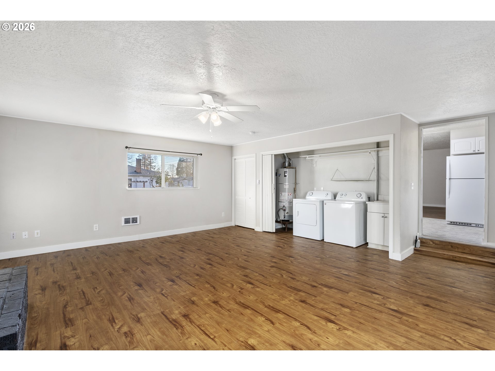 8705 Southeast Pardee Street Portland, OR 97266 - Photo 13 of 32 a view of a room with wooden floor and white walls