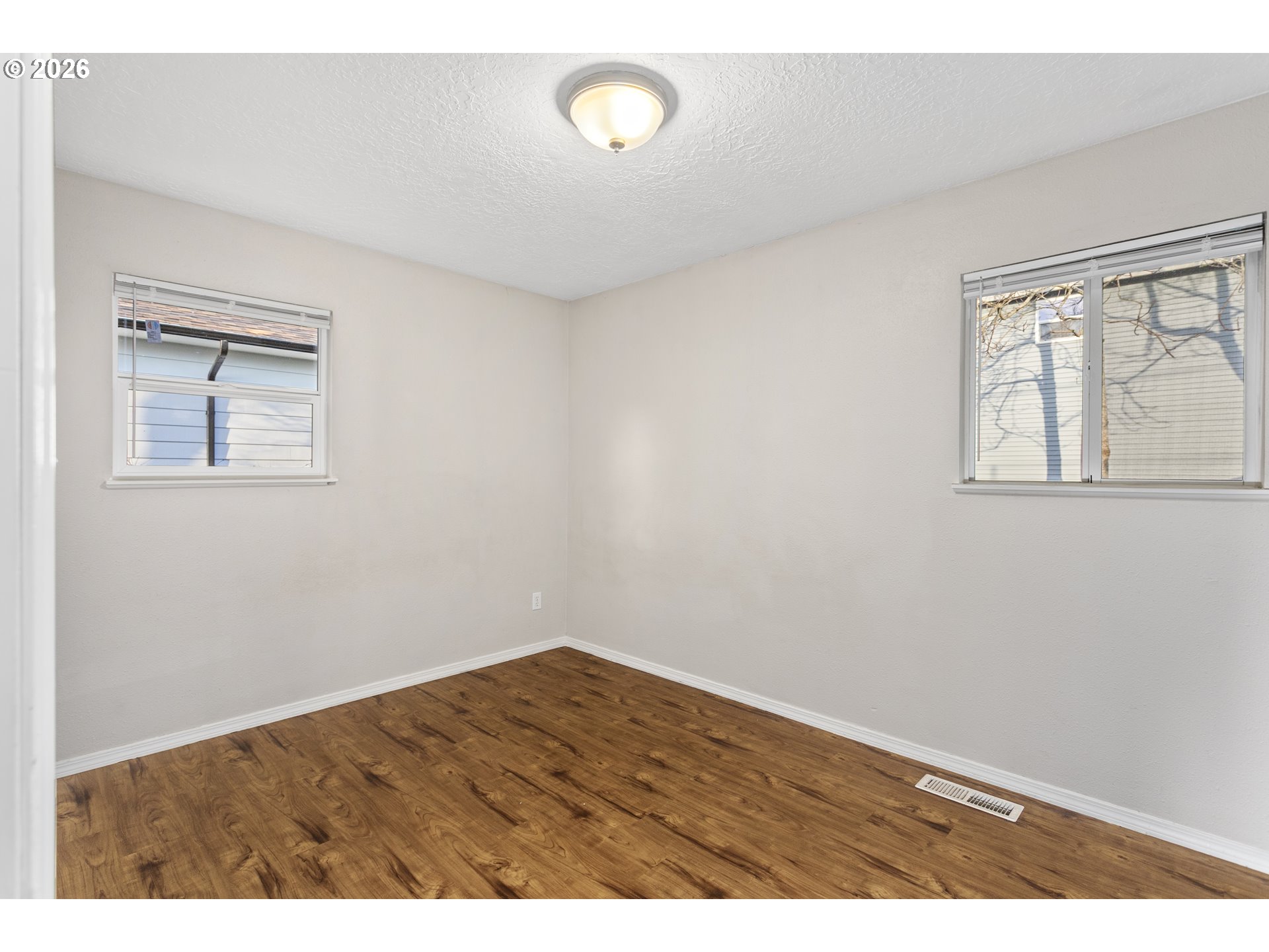 8705 Southeast Pardee Street Portland, OR 97266 - Photo 16 of 32 an empty room with a window
