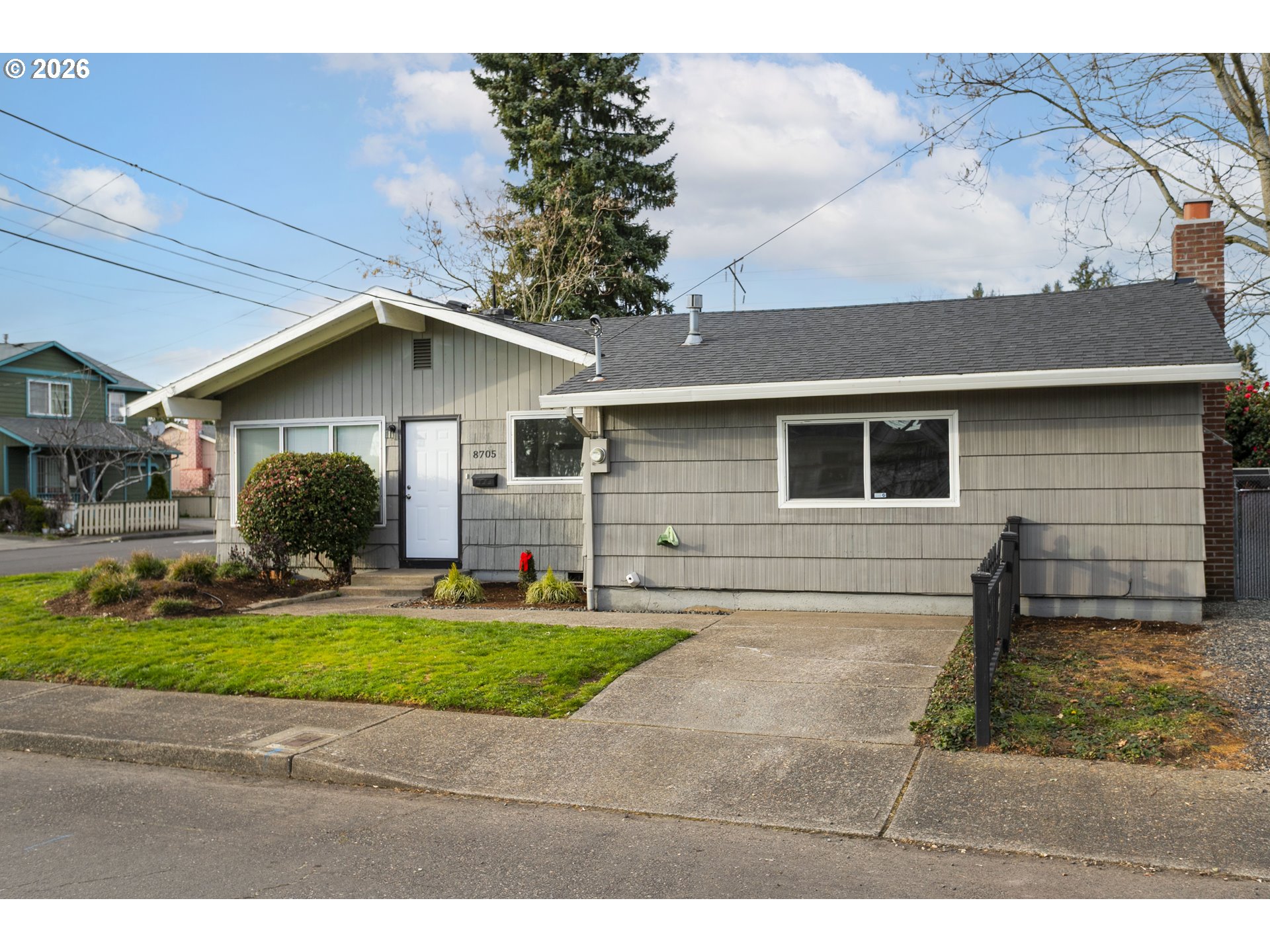 8705 Southeast Pardee Street Portland, OR 97266 - Photo 2 of 32 a view of a yard in front of a house