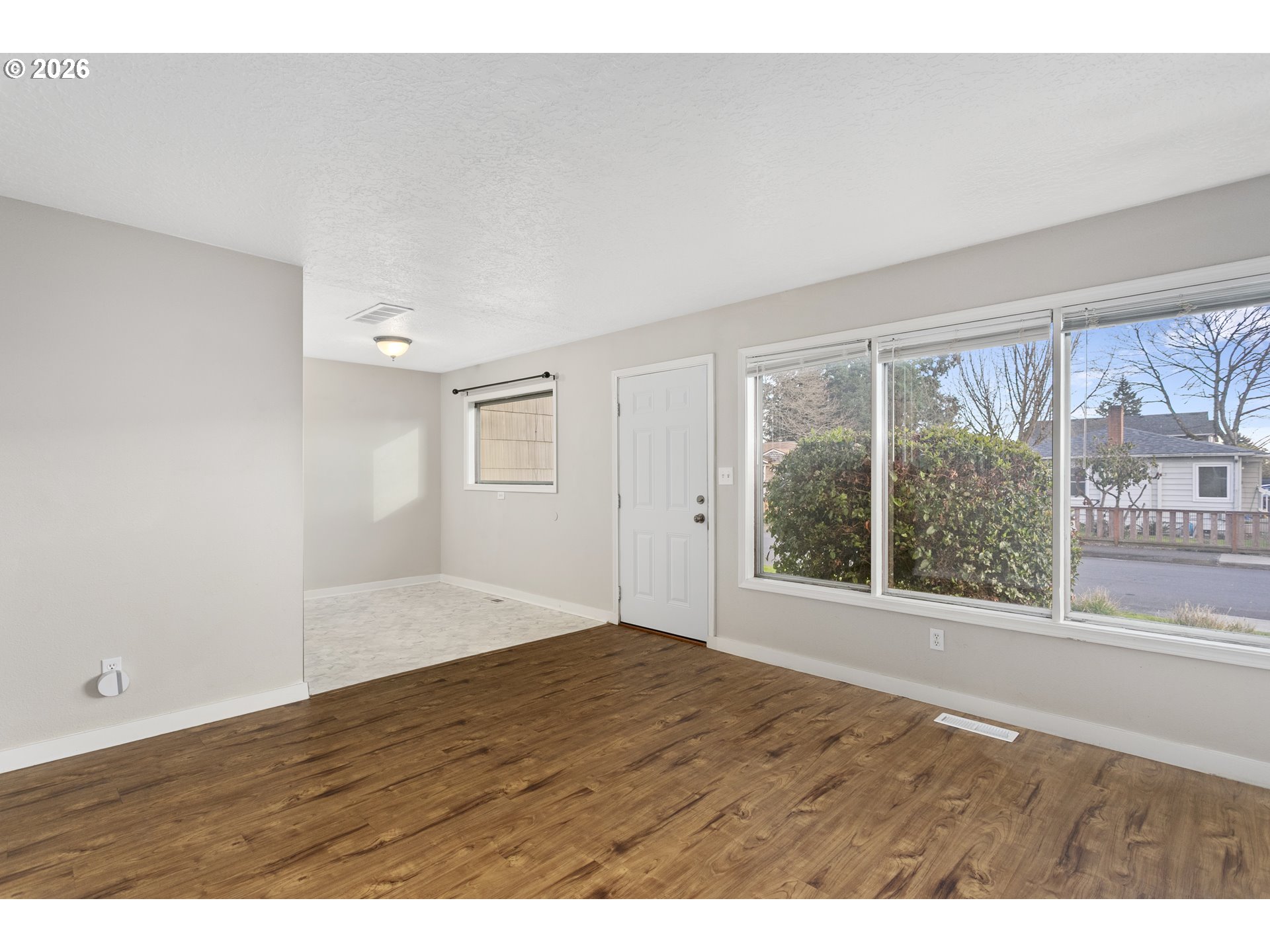 8705 Southeast Pardee Street Portland, OR 97266 - Photo 4 of 32 a view of an empty room with a window