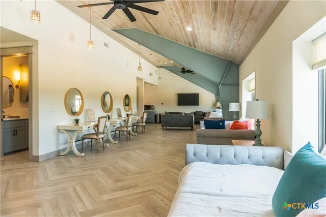 a bathroom with a sink mirror and a bathtub