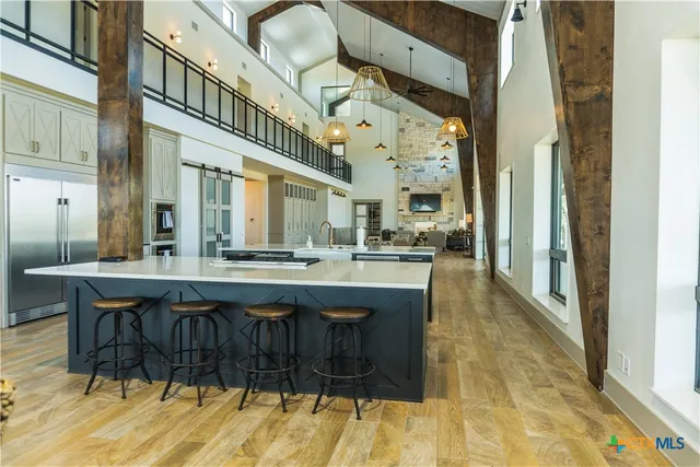 a dining room with furniture and wooden floor