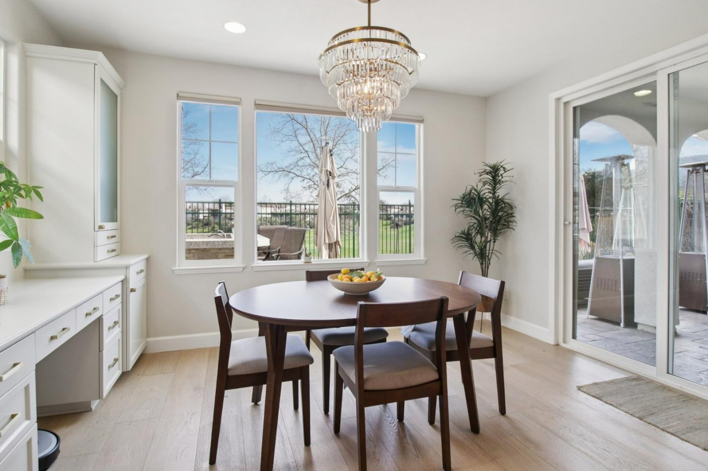 7670 MacKenzie Way Gilroy, CA 95020 - Photo 19 of 70 a view of a dining room with furniture wooden floor and chandelier