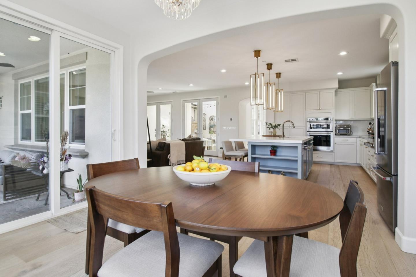 7670 MacKenzie Way Gilroy, CA 95020 - Photo 20 of 70 a view of a dining room with furniture and a chandelier