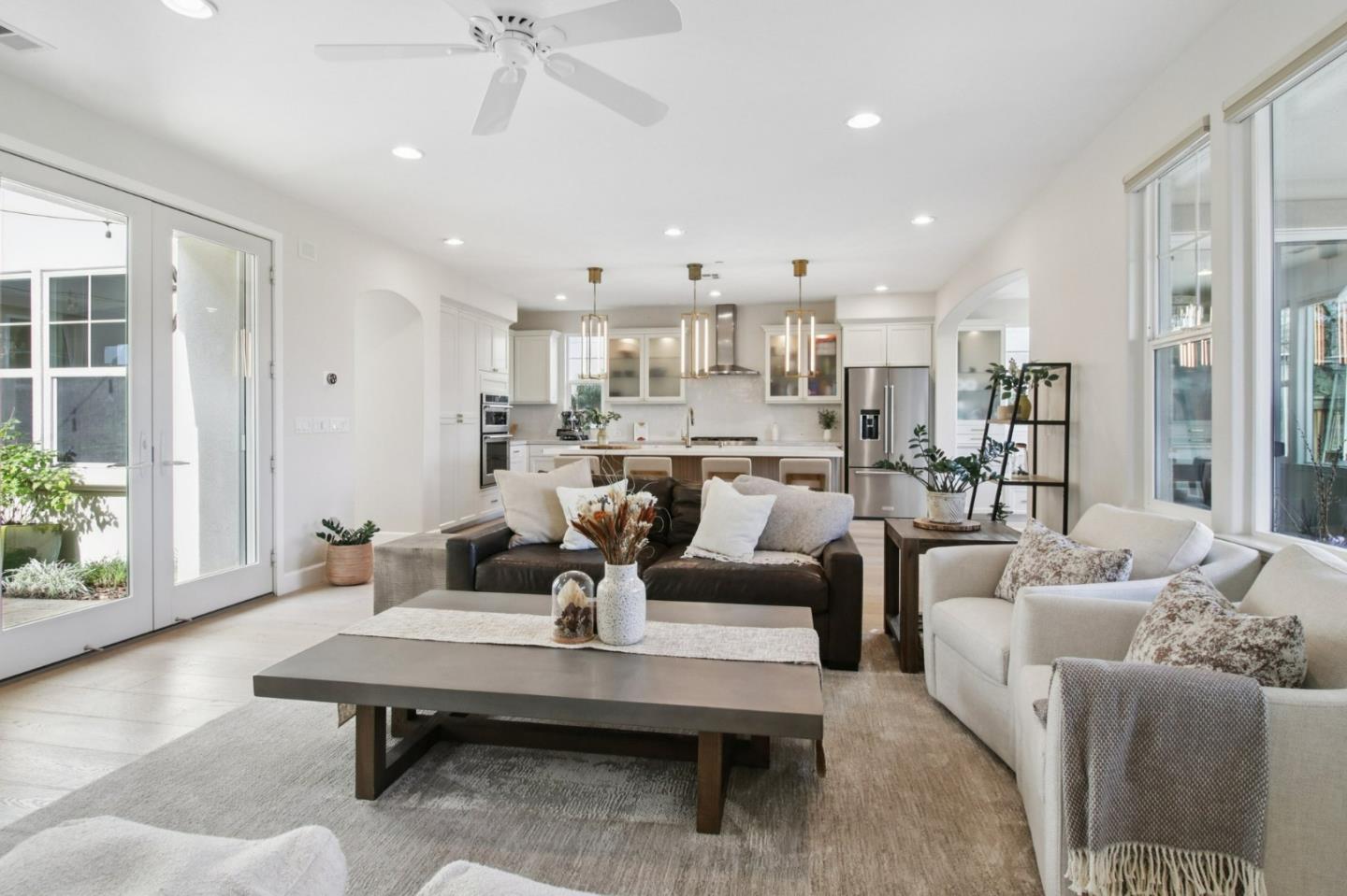 7670 MacKenzie Way Gilroy, CA 95020 - Photo 25 of 70 a living room with furniture and a large window