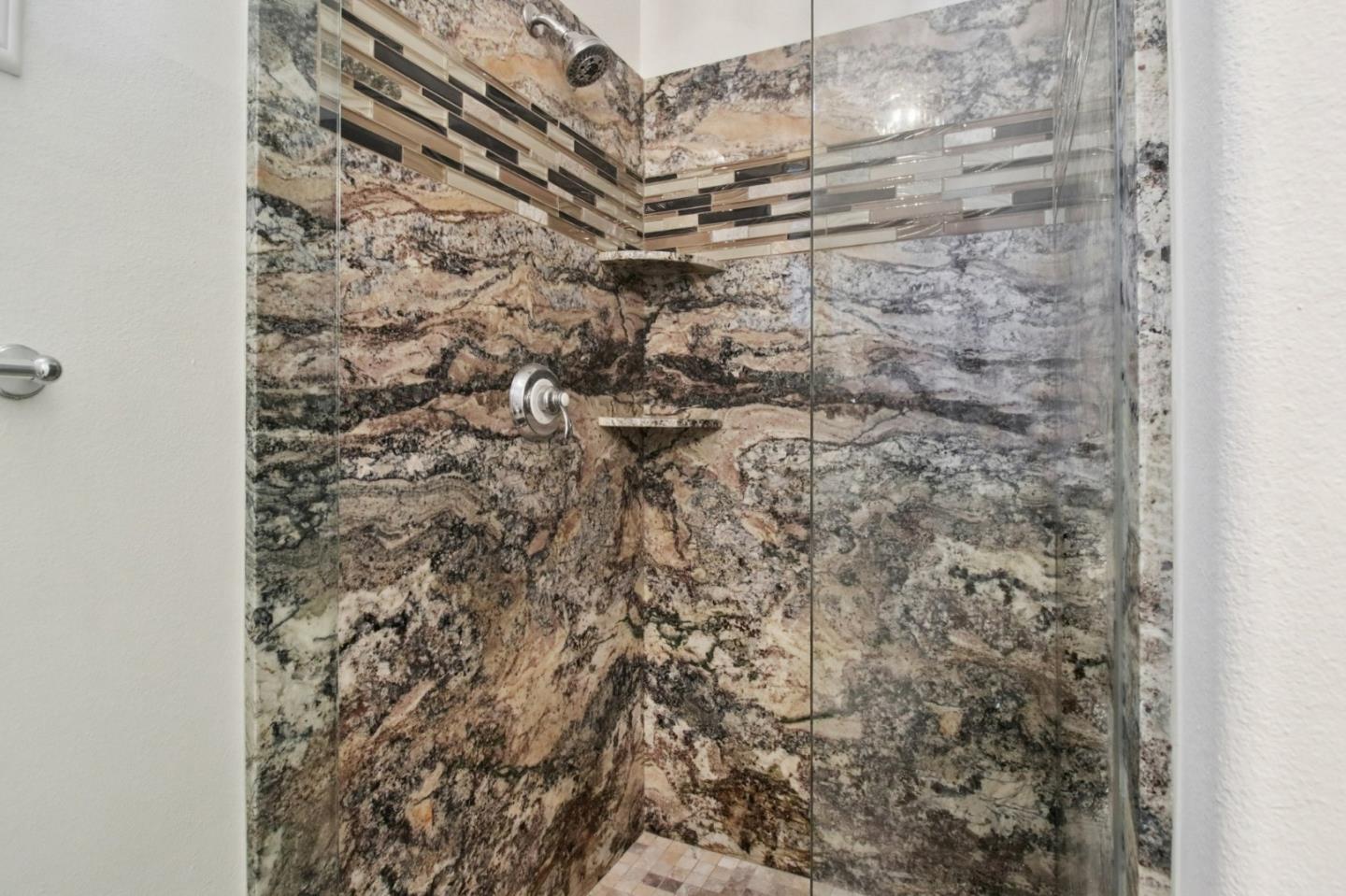 7670 MacKenzie Way Gilroy, CA 95020 - Photo 27 of 70 a bathroom with a shower curtain