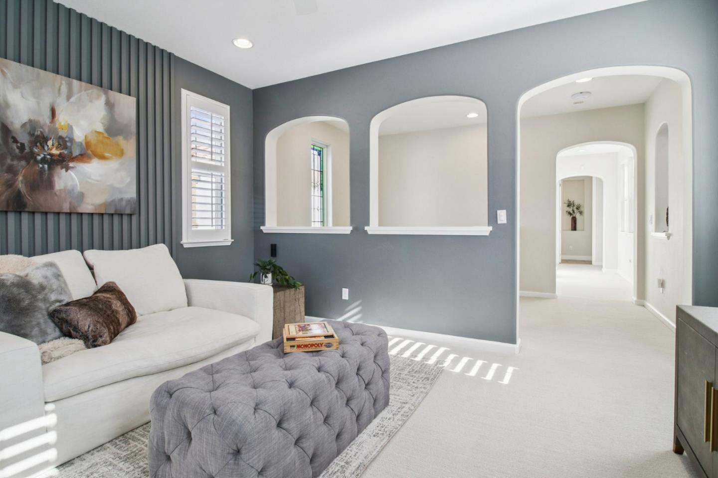 7670 MacKenzie Way Gilroy, CA 95020 - Photo 32 of 70 a living room with furniture and a painting on the wall