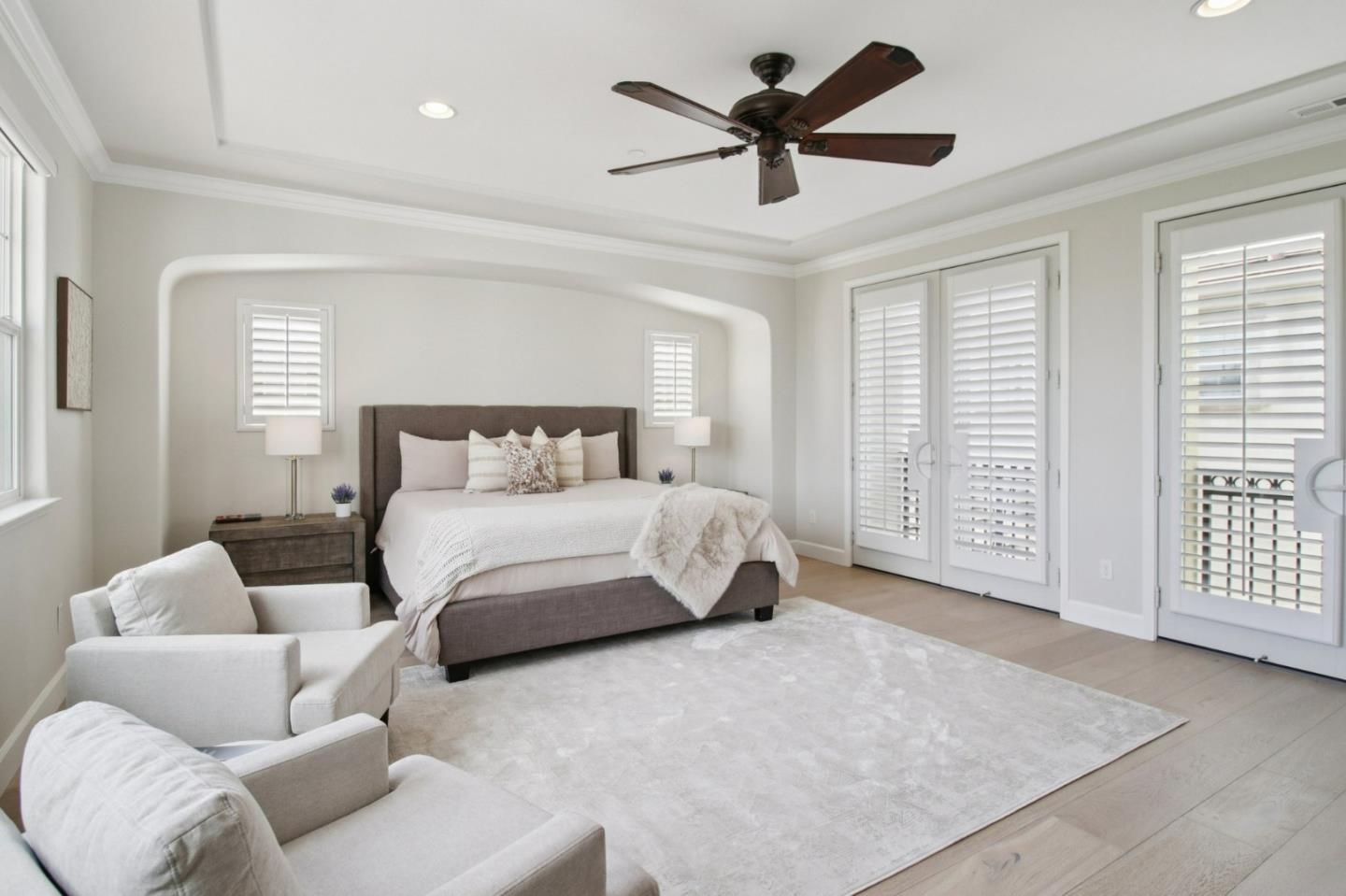 7670 MacKenzie Way Gilroy, CA 95020 - Photo 48 of 70 a bedroom with a large bed couch and windows