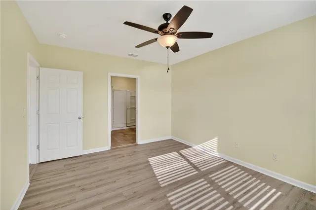 a bathroom with a granite countertop sink mirror and shower