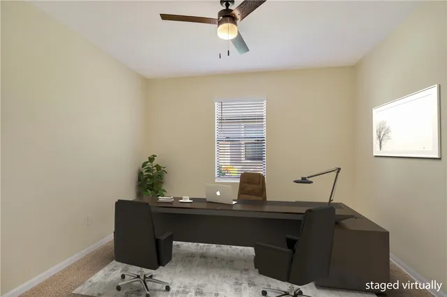 an empty room with ceiling fan