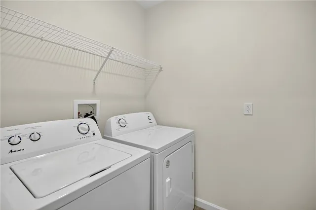 a view of an house with backyard and porch