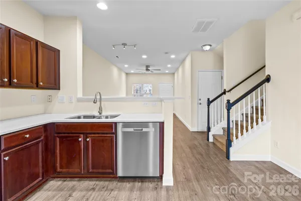 a kitchen with a sink and cabinets
