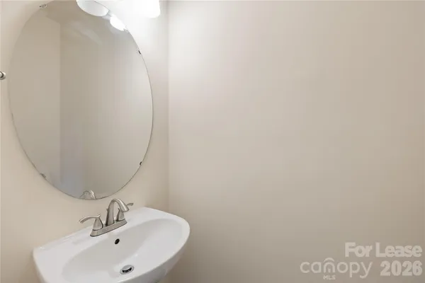 a bathroom with a sink and mirror