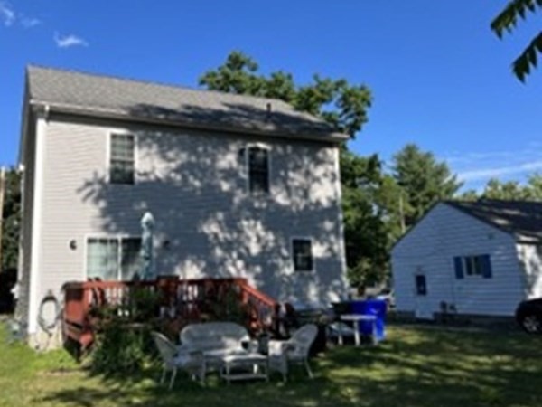 70 Penrose Street Springfield, MA 01109 - Photo 3 of 6 a front view of house with a garden