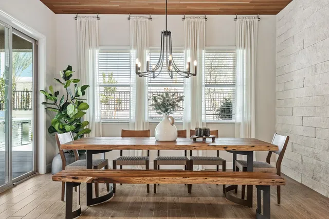 a dining room with furniture and window