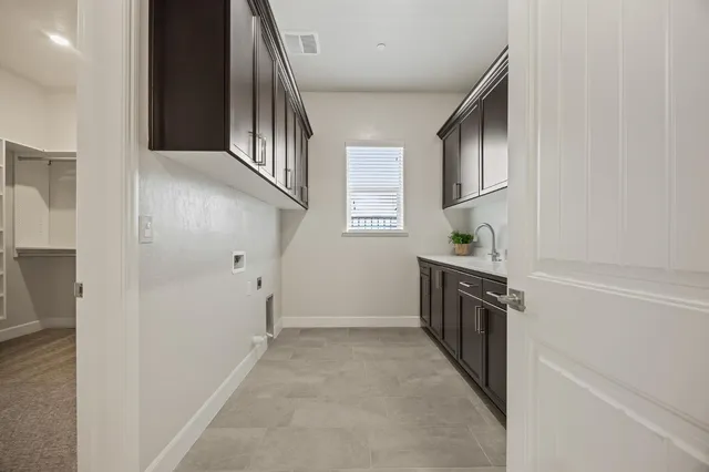 a kitchen with granite countertop a refrigerator and a stove