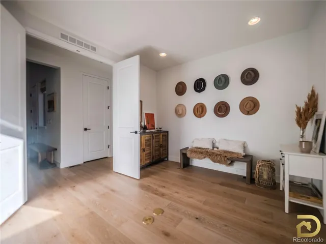 a view of room with furniture and wooden floor