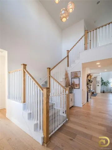 a view of entryway and hall with wooden floor