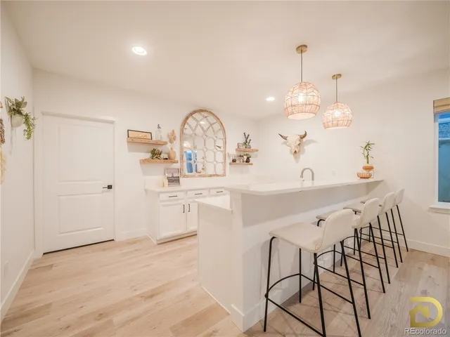a very nice looking dining room with a table and chairs in it