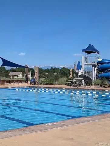 a view of a kitchen with wooden floor and city view