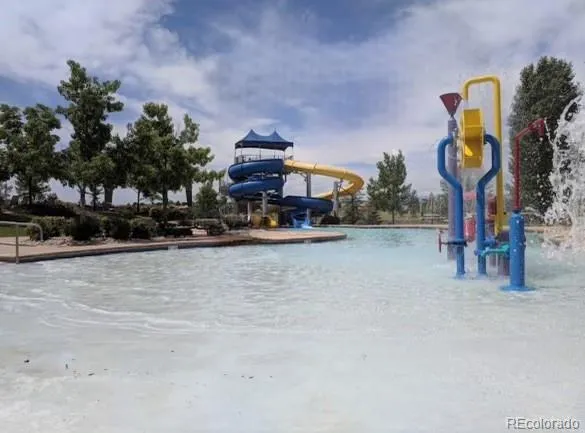 a front view of a house with a yard and a garage