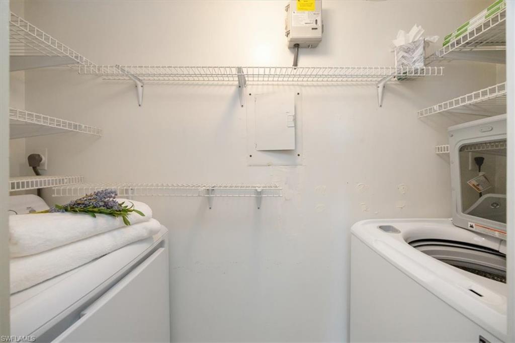 21 High Point Circle East, Unit 502 Naples, FL 34103 - Photo 16 of 24 a utility room with dryer and washer