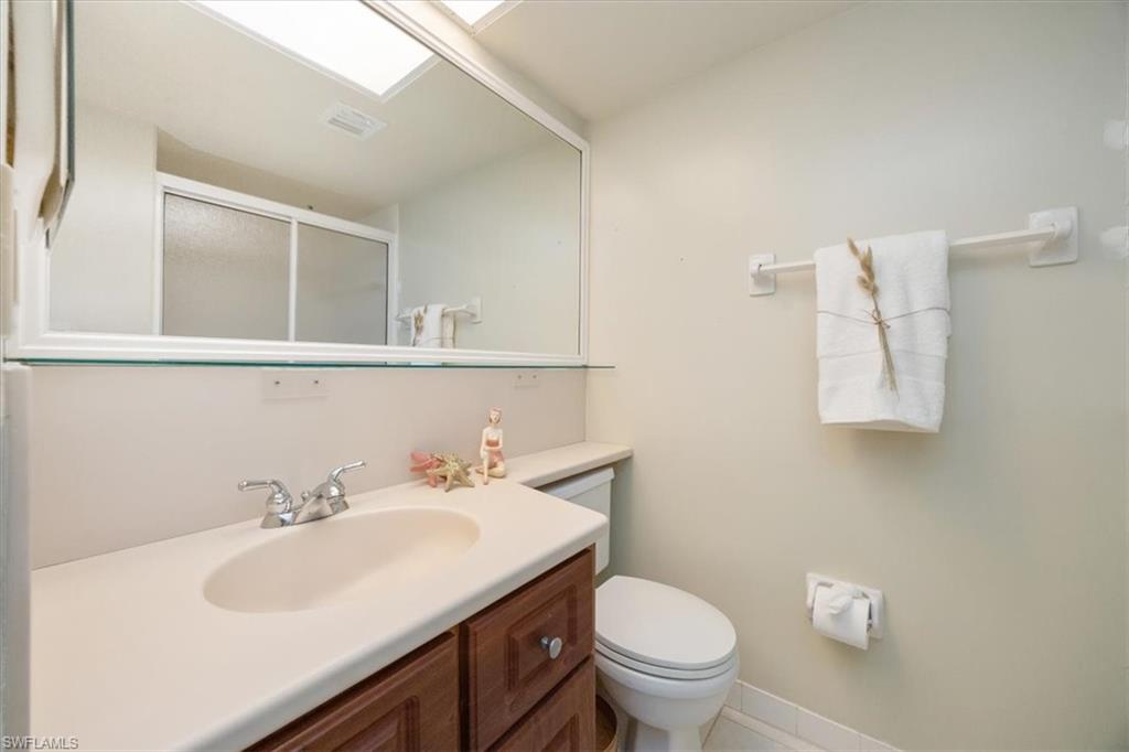 21 High Point Circle East, Unit 502 Naples, FL 34103 - Photo 18 of 24 a bathroom with a sink and a toilet