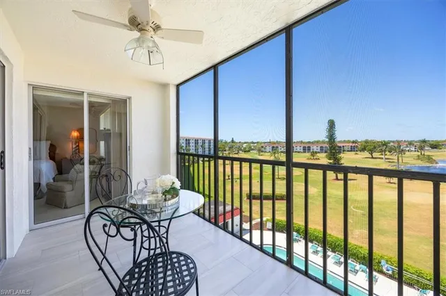 a view of a chairs and table in patio