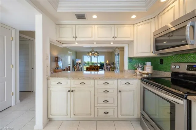 a kitchen with a sink and a stove top oven