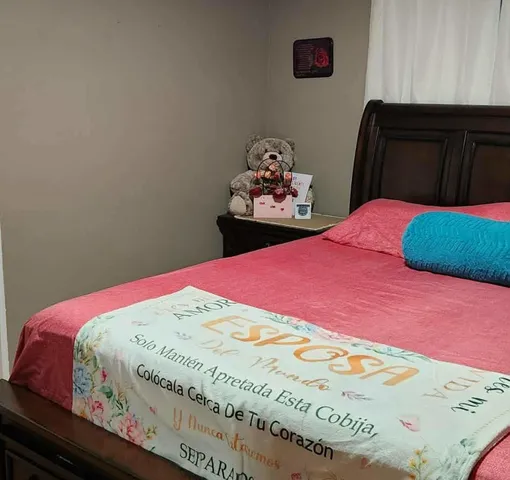 a bedroom with a bed and a cabinets