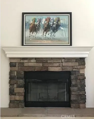 a close view of fireplace and a painting on the wall
