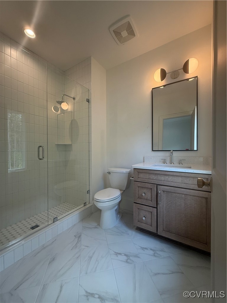 1120 Cardinal Crest Terrace Midlothian, VA 23113 - Photo 26 of 44 a bathroom with a toilet sink and mirror