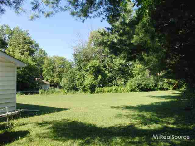 7389 Zenith Road Lexington, MI 48450 - Photo 3 of 11 Extra large lot. 210 ft frontage. photo shows side yard.