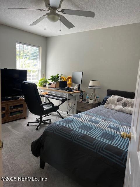 385 Scrub Jay Drive St. Augustine, FL 32092 - Photo 11 of 16 a bedroom with a bed a desk and chair