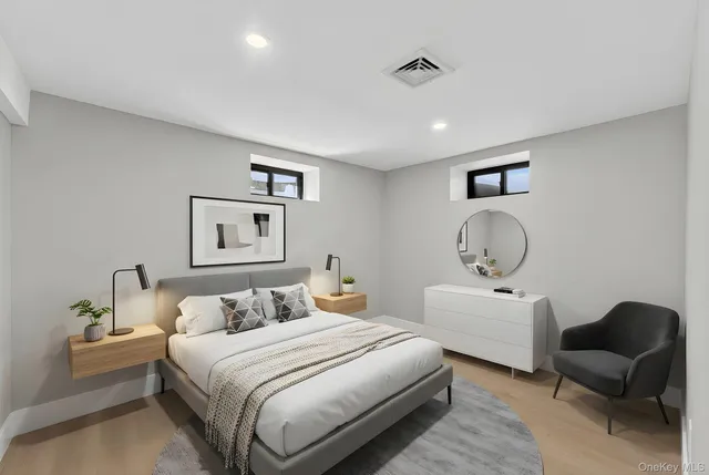 a bedroom with bed and a chandelier