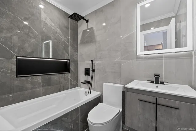 a bathroom with a sink a toilet and a bathtub