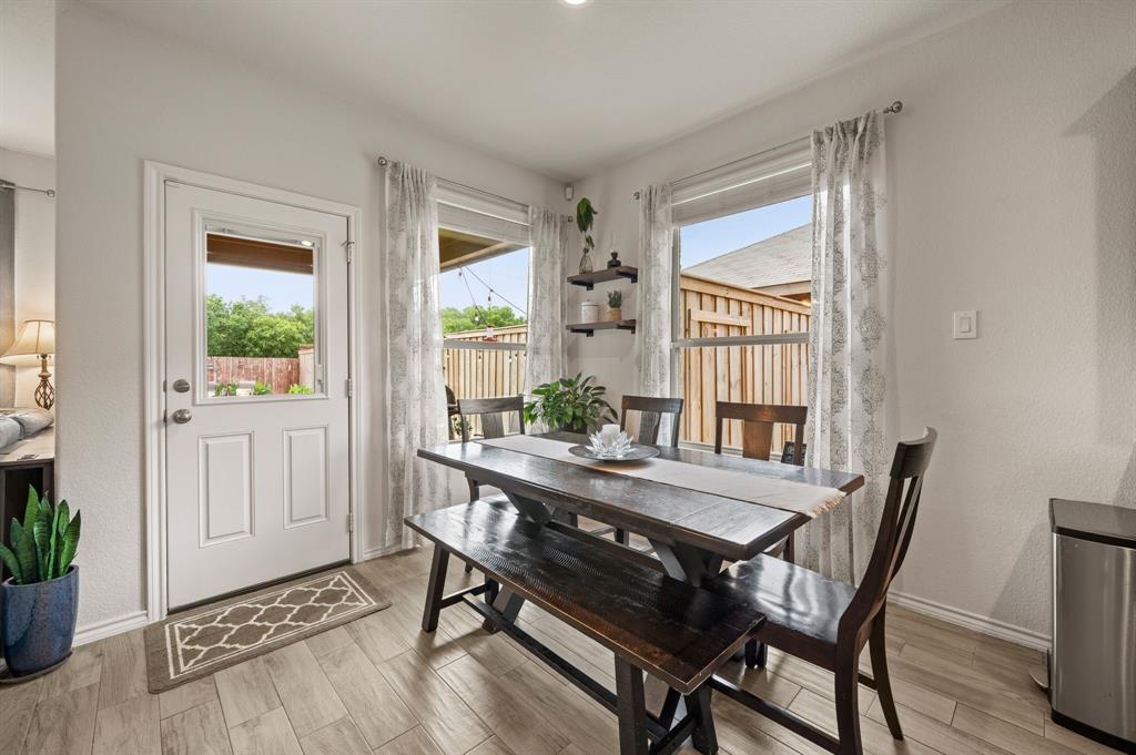 15817 White Mill Road Fort Worth, TX 76177 - Photo 12 of 27 a view of a dining room with furniture window and wooden floor