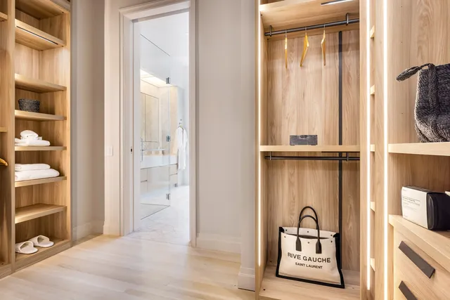 a bathroom with a bathtub a sink a mirror and a shower