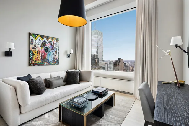 hallway with wooden floor and mirror