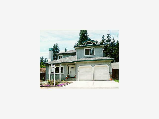 3179 Polo Drive Aptos, CA 95003 - Photo 1 of 1 a bathroom with a sink a mirror and potted plants
